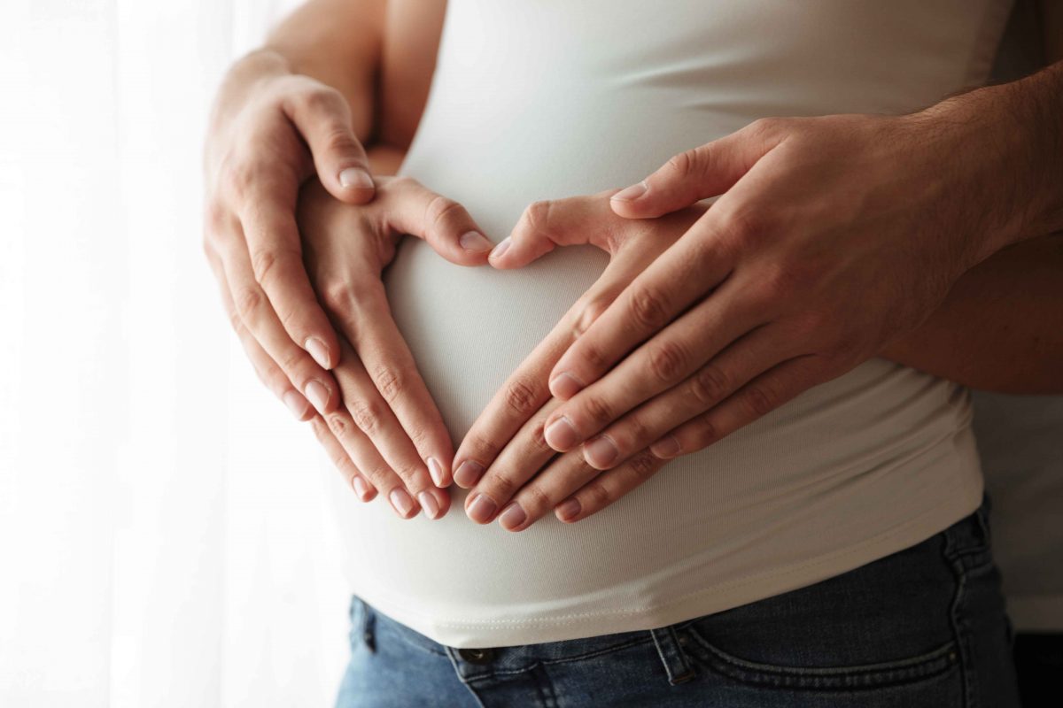 pregnant couple trying fertility massage