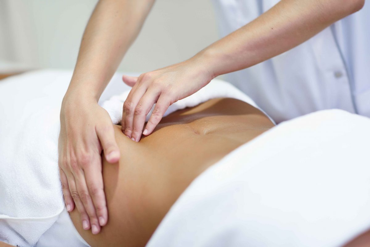 Woman receiving fertility massage treatment